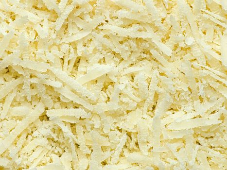 close up of finely grated parmagiano reggiano cheese food background