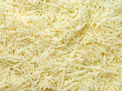 close up of finely grated parmagiano reggiano cheese food background
