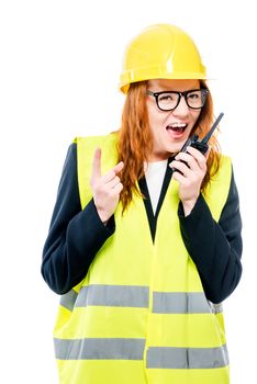 Young girl foreman screaming in walkie-talkie on white background