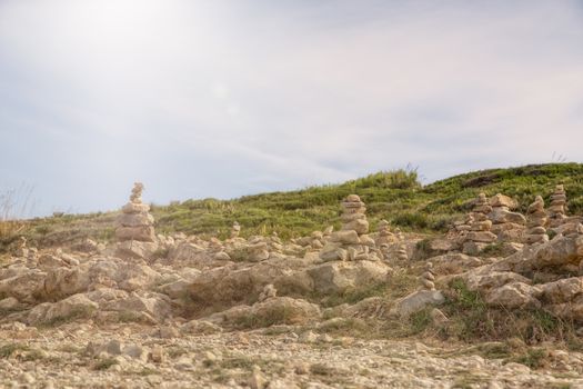 Landscape scenery with little rocks, blue sky and sun