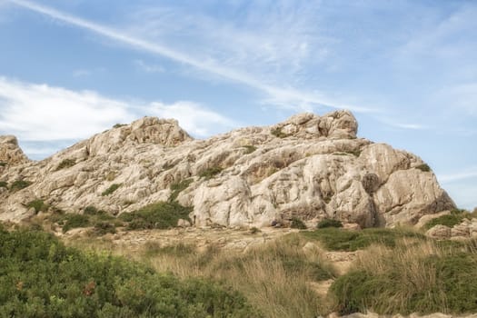 Little rocks with a blue sky and some clouds