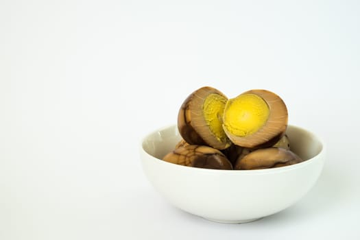 Tradional chinese herbal eggs in a white bowl