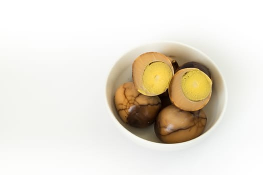 Tradional chinese herbal eggs in a white bowl