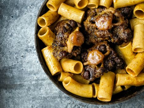 close up of a pan of rustic italian oxtail ragu pasta