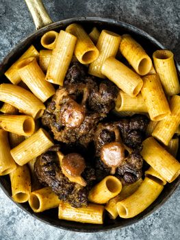 close up of a pan of rustic italian oxtail ragu pasta