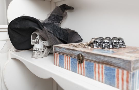 Human skull in a white cabinet. Halloween theme