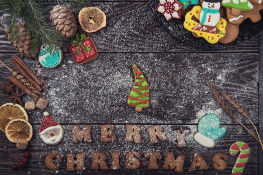 Homemade ginger cookies for new years and christmas on wooden background, xmas theme