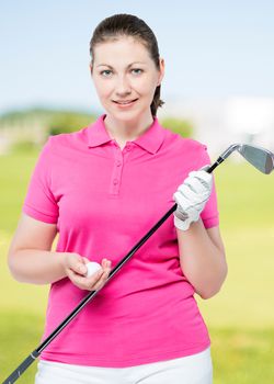 Vertical portrait of a golfer with equipment on a background of golf courses