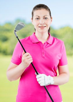 Vertical portrait in the studio a woman golfer on a background of golf courses