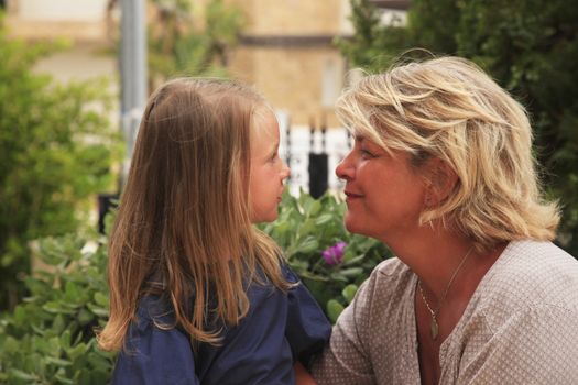 Grandmother with her granddaughter in the park