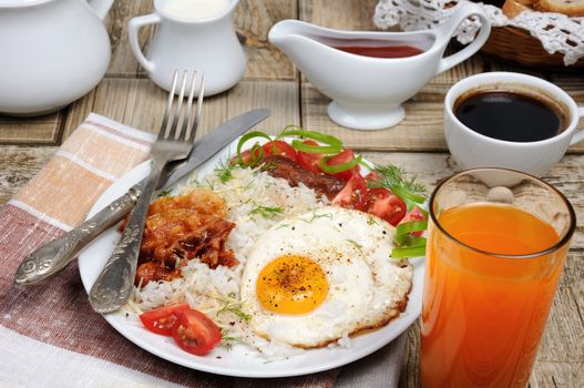   Breakfast - Soft boiled rice with scrambled eggs, bacon, tomato slices and greens