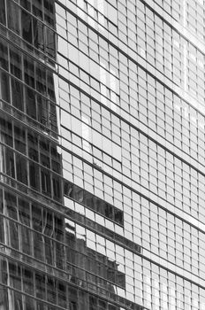 Sky reflected in the windows of a modern office building