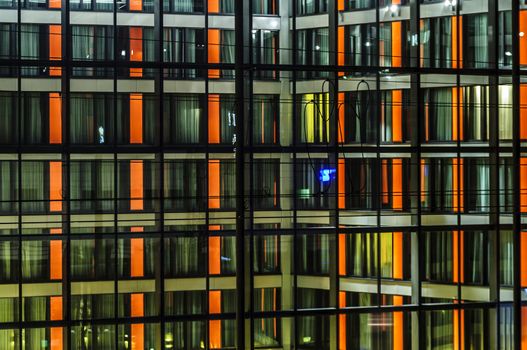 Illuminated night front of modern building