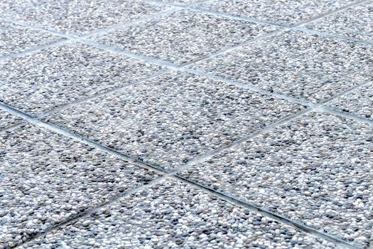 Detailed shot of pebbled tiles, outdoors terrace flooring
