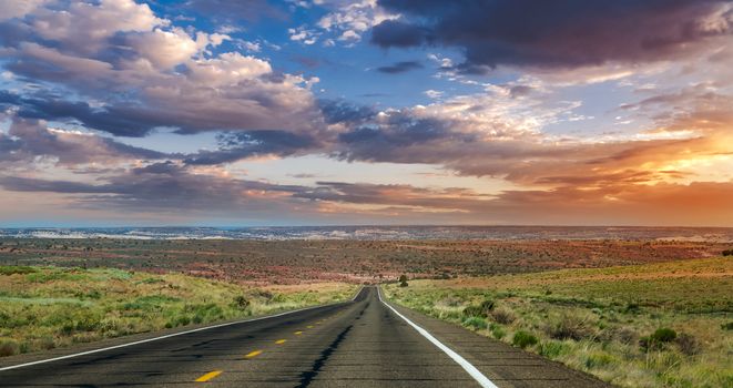 Straight road into the sunset in Arizona