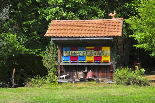 Traditional colorful and picturesque wooden bee hives in Slovenia. The hives are brightly painted to allow the bees find their hives.