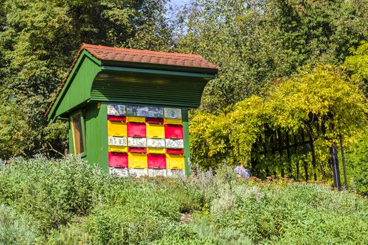 Traditional colorful and picturesque wooden bee hives in Slovenia. The hives are brightly painted to allow the bees find their hives.