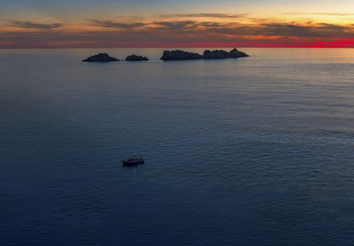 Lighthouse in sunset on island Grebeni, Dubrovnik, Croatia, view from Lapad peninsula