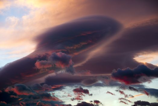 Dramatic skies with Lenticular cloud - Altocumulus lenticularis in sunset
