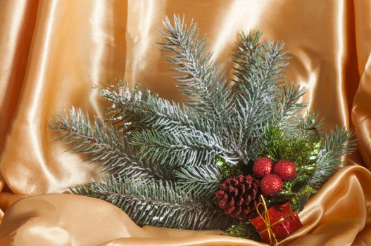  a Christmas decorations on a golden fabric background