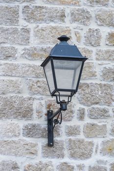 Vintage, old street lamp in classic style, made of cast iron and or metal