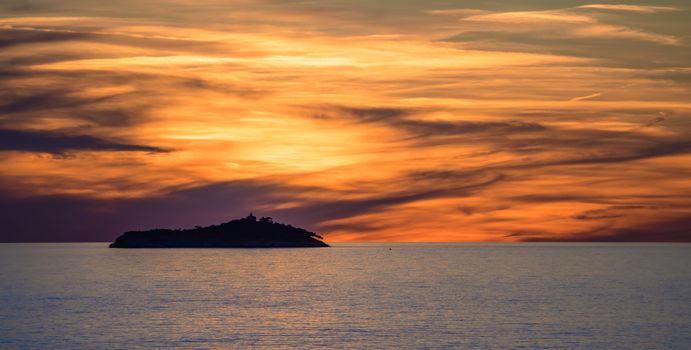 Sunset over Sveti Andrija island near Dubrovnik, Croatia, with it's distinct lighthouse