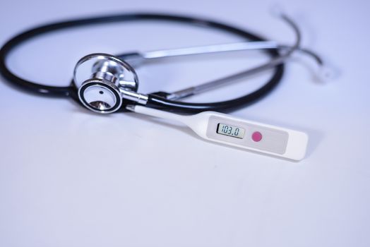 A thermometer and stethoscope