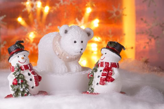 Two snowmen with polar bear, Happy New Year 2017, Christmas, bright defocused lights in background