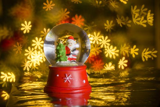 Christmas decoration, Santa Claus with flower shaped lights in background, flower shaped bokeh blur