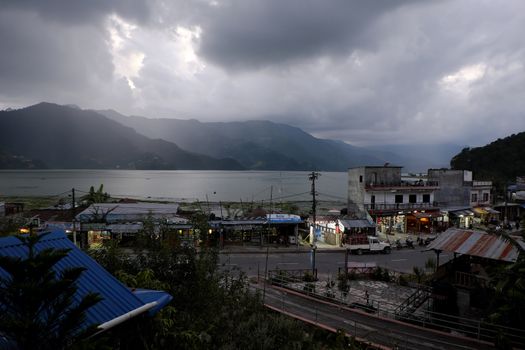 NEPAL. POKHARA — SEPTEMBER 30, 2016 : View of the North Lakeside in Pokhara from the hotel's balcony, in front of the storm. Pokhara second most important and largest city of Nepal.