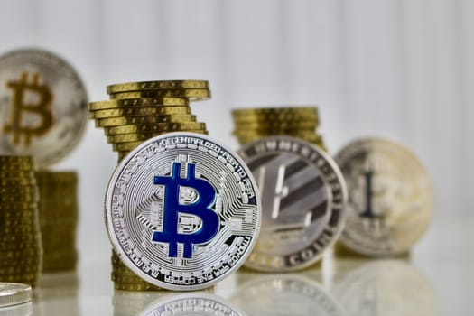 Digital currency physical silver bitcoin coin. Litecoin and gold money.