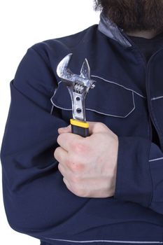 Male hand holding an adjustable wrench on white background