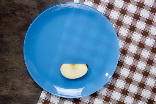 Plate and napkin on a wooden table