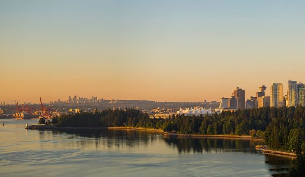 Vancouver British Columbia Canada cityscape by Stanley Park with Burnaby city view during early morning sunrise panorama