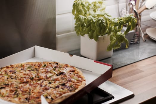 Fresh and tasty vegetarian spicy pizza in the kitchen. Fast food concept.