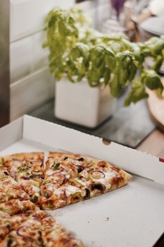 Fresh and tasty vegetarian spicy pizza in the kitchen. Fast food concept.