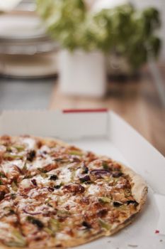 Fresh and tasty vegetarian spicy pizza in the kitchen. Fast food concept.
