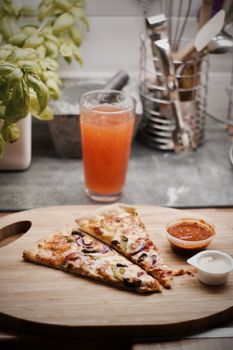 Fresh and tasty vegetarian spicy pizza in the kitchen. Fast food concept.