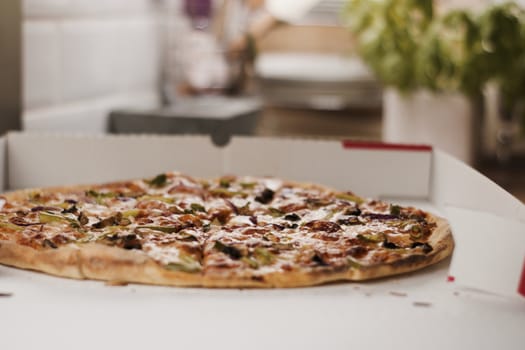 Fresh and tasty vegetarian spicy pizza in the kitchen. Fast food concept.