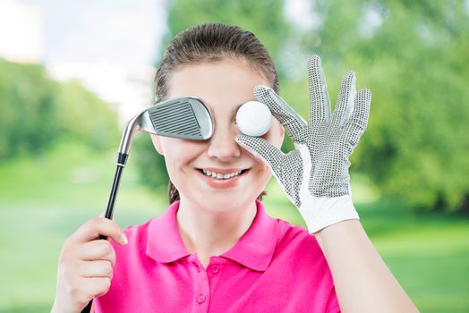 Funny portrait of happy golfers with an eye ball isolated on a background of golf courses