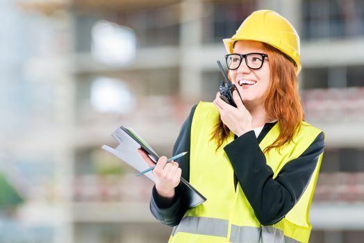 Professional foreman with radio at the construction site