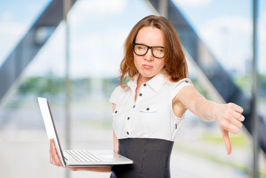 dissatisfied businesswoman shows thumb down. Failure in the office