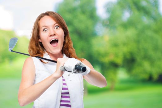 Shocked golfer looking behind the trajectory of a ball flying on a background of golf courses