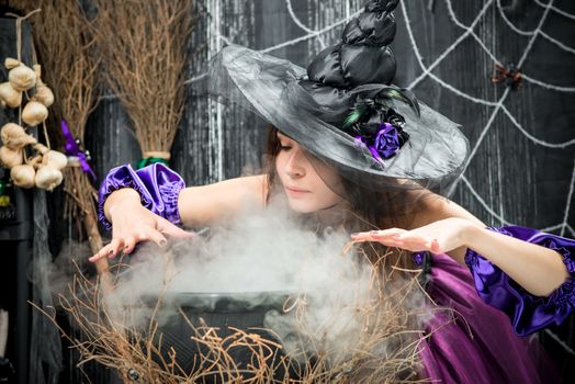 concentrated witch in a hat cooking a love potion