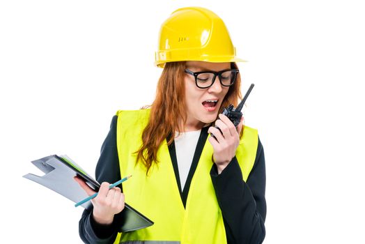 woman foreman with radio and folder on white background