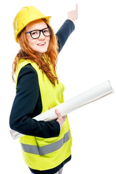 vertical portrait of a woman in a helmet and vest with a house plan on a white background