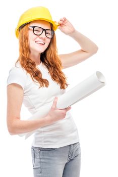 Builder young woman with projects in a yellow hard hat against a white background