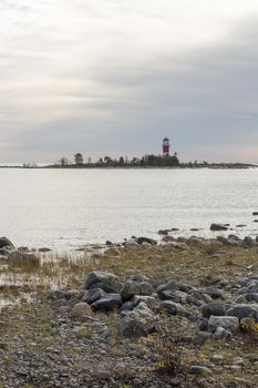 Light House in Holmsund, Sweden with a cloudy sky.