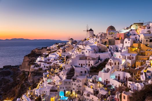 World famous Oia village or Ia at sunset, Santorini island, Greece.