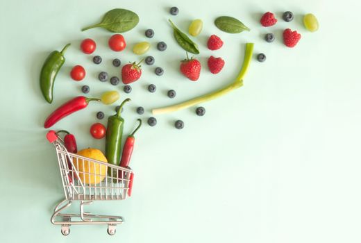 Small shopping cart with fruits and vegetables